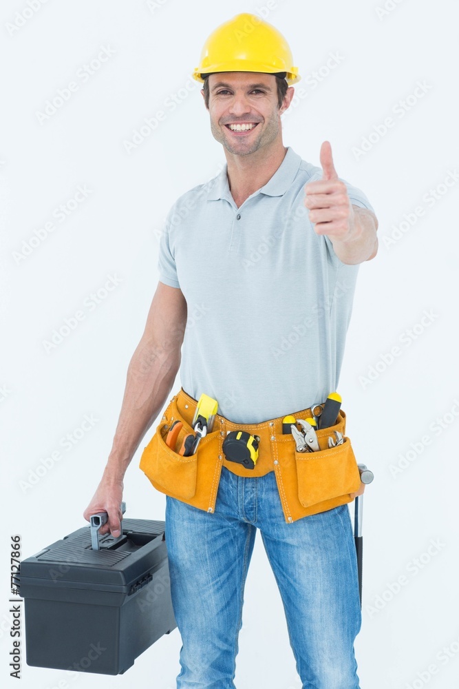 Poster Handyman showing thumbs up while holding tool box