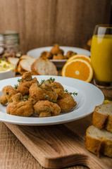 Breaded fried mushrooms with juice