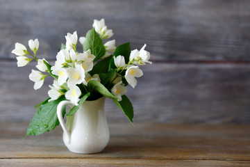 Jasmine in a vase on the boards