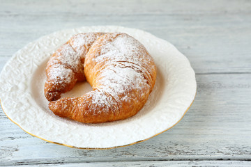 Delicious croissant on a plate