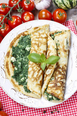 Mediterranean cuisine: crepes stuffed with cheese and spinach