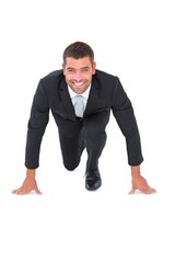 Smiling businessman crouching
