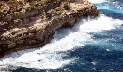 very high cliff on the rough sea with waves