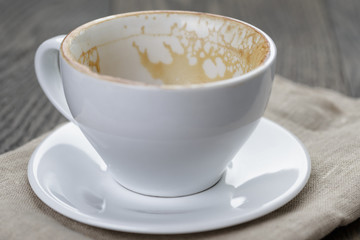 empty coffee cup on oak wood table