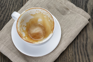 empty coffee cup on oak wood table