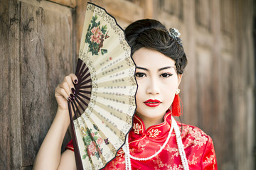 Chinese woman red dress traditional cheongsam ,close up portrait