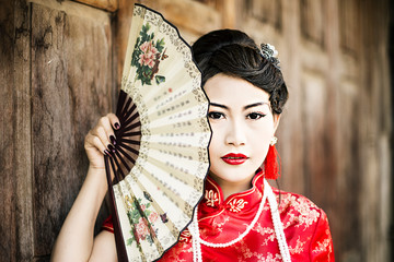 Chinese woman red dress traditional cheongsam ,close up portrait