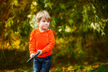 Boy in the autumn park