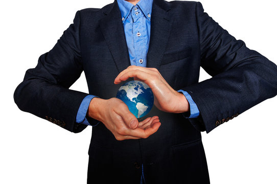 Business manager holding an Earth globe. Business man in  suit