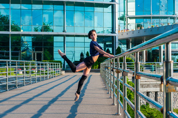 Fototapeta na wymiar Ballerina dancing in casual clothes standing on tiptoes