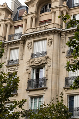 Fototapeta na wymiar facade of typical house with balcony in Paris, France