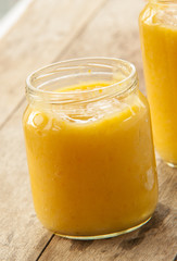 Jar of carrot baby food close up