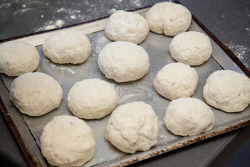 Fototapeta na wymiar baking wholewheat bread rolls