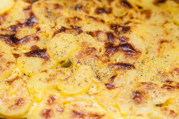 Closeup of baked potatoes with cheese