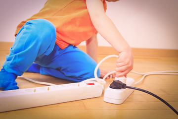child playing with electricity