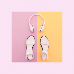 Fashion white sandals and headphones on vanilla background. Urba