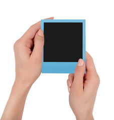 Color polaroid in woman hands