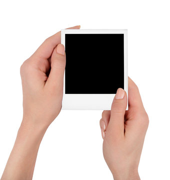 Female hands hold polaroid image