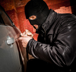 Car thief in a mask.