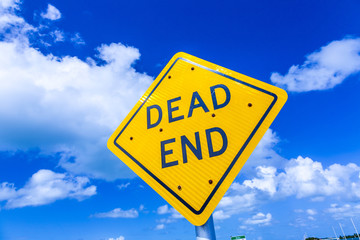 dead end street sign under blue sky