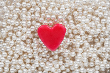 Hearts lying on the white beads