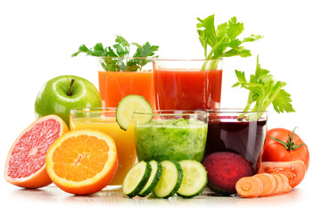 Glasses with fresh organic vegetable and fruit juices on white