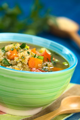 Vegetarian quinoa soup with carrot, potato, leek and tomato