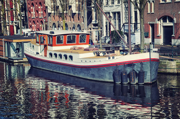 Fototapeta na wymiar Canals of Amsterdam with big Boat