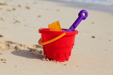 kids toys on sand beach