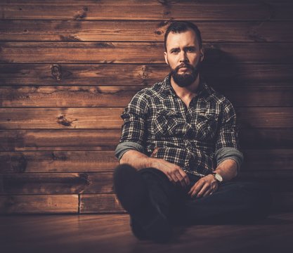 Man Wearing Checkered Shirt In Wooden Rural House