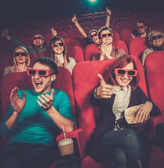 Group of people in 3D glasses watching movie in cinema - obrazy, fototapety, plakaty