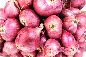 Couple of dry red onion on white background