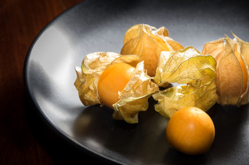 Physalis fruit or capegooseberry on plate.