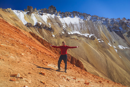 Hiker on colored mountain
