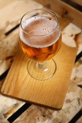 Glass of beer in a crate