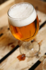 Glass of beer in a crate