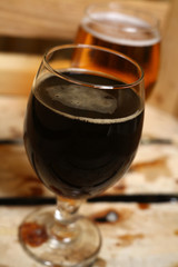 Two glasses of beer in a crate