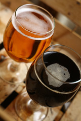 Two glasses of beer in a crate