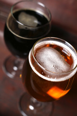Two glasses of beer in a case