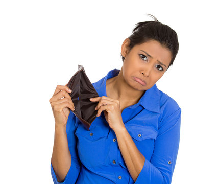 unhappy young woman standing showing empty wallet 