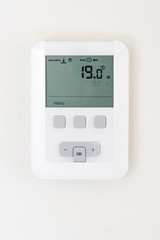 Thermostat on white wall