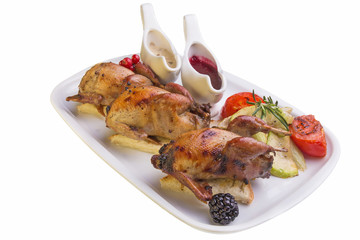 Roasted quail with vegetables on white background
