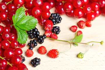 Fresh mixed berries on wood table