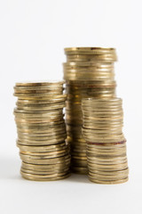 Columns of coins isolated on white background