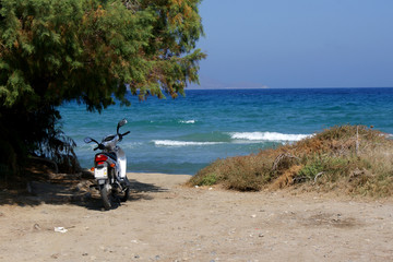 Scooter on the beach, Greece.