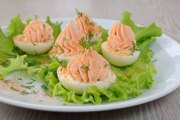 Eggs stuffed with salmon pate in lettuce leaves