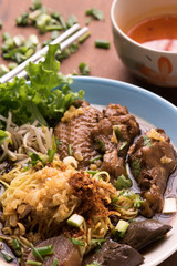 Wheat chicken noodles in broth with vegetables and meat