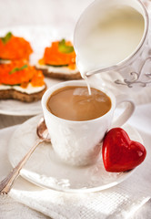 Romantic breakfast with coffee and toasts
