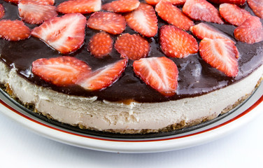 Strawberry cheesecake closeup isolated on white