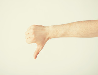 man showing thumbs down